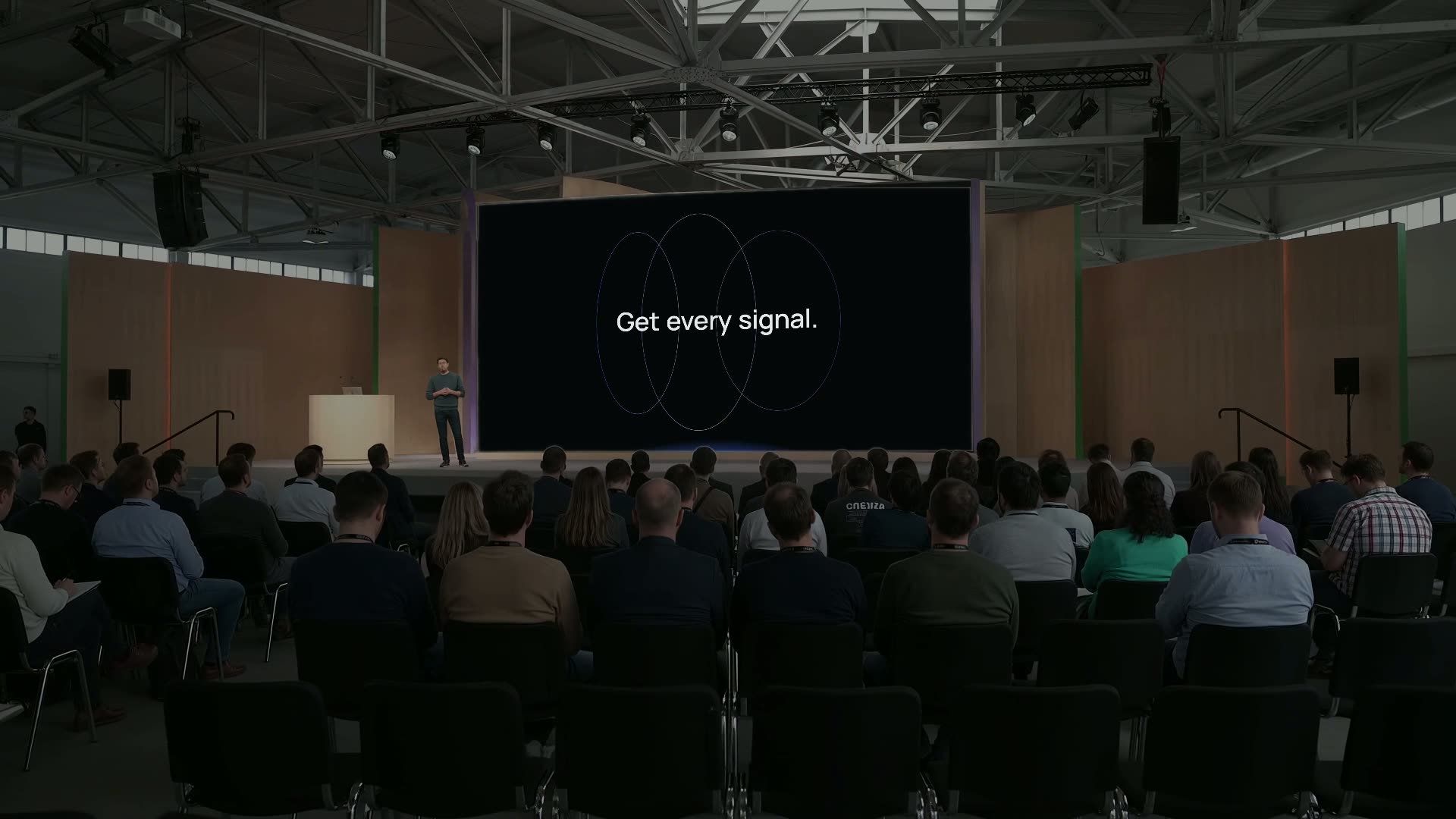 Premiss on a large stage screen, ending on the line Get every signal.